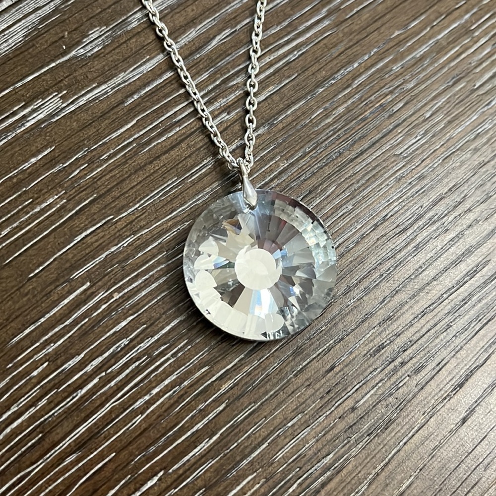 Icing silver tone chain with a big bold crystal bling pendant